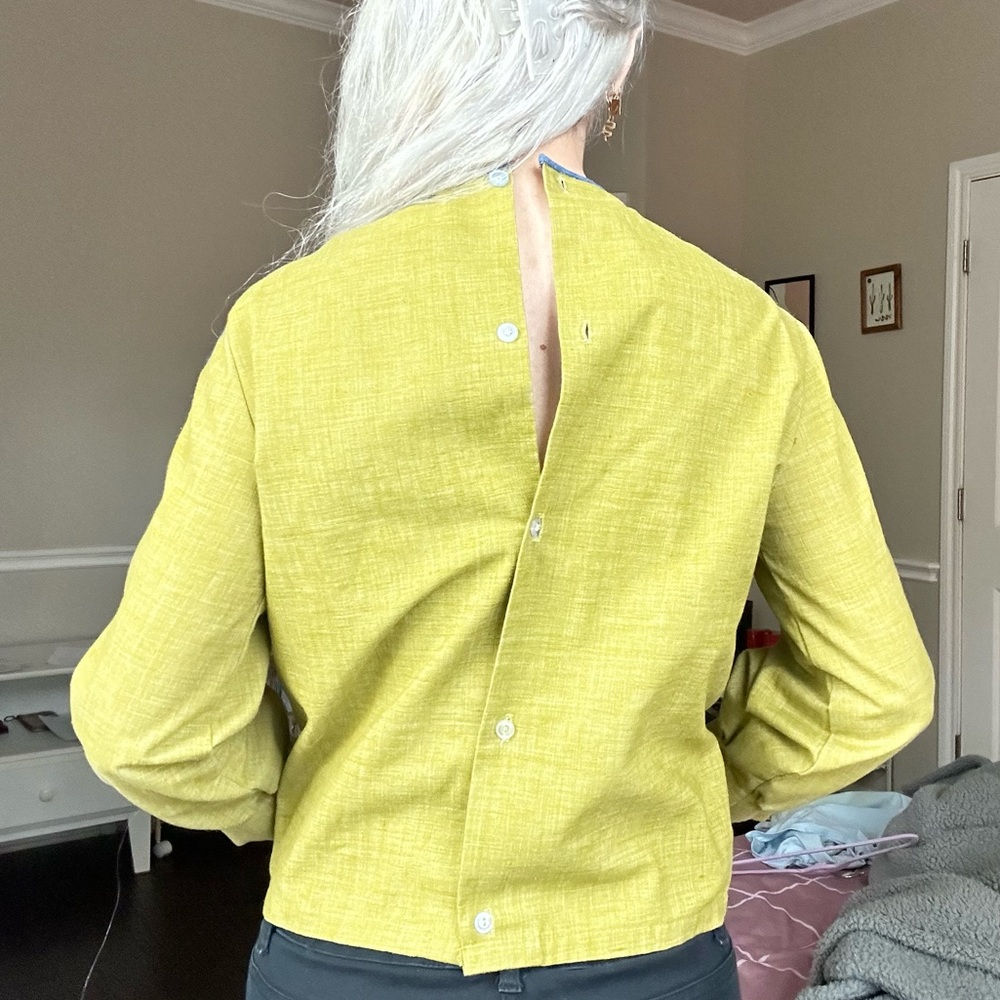 vintage green linen top with buttons on back and blue stitching